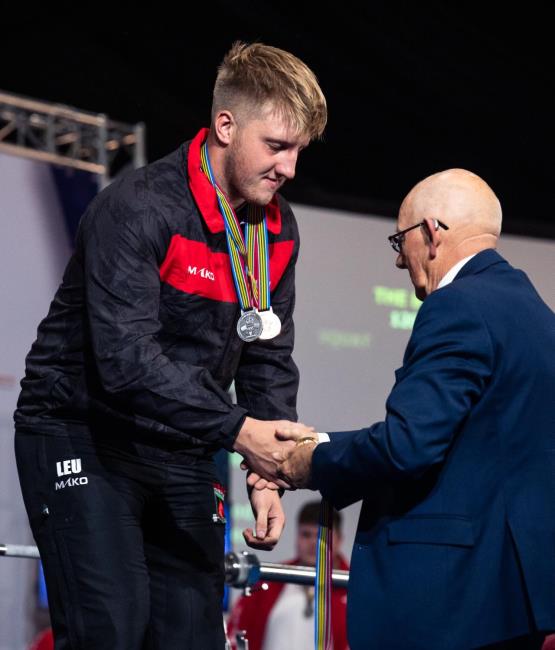 Ieuan collecting his medal